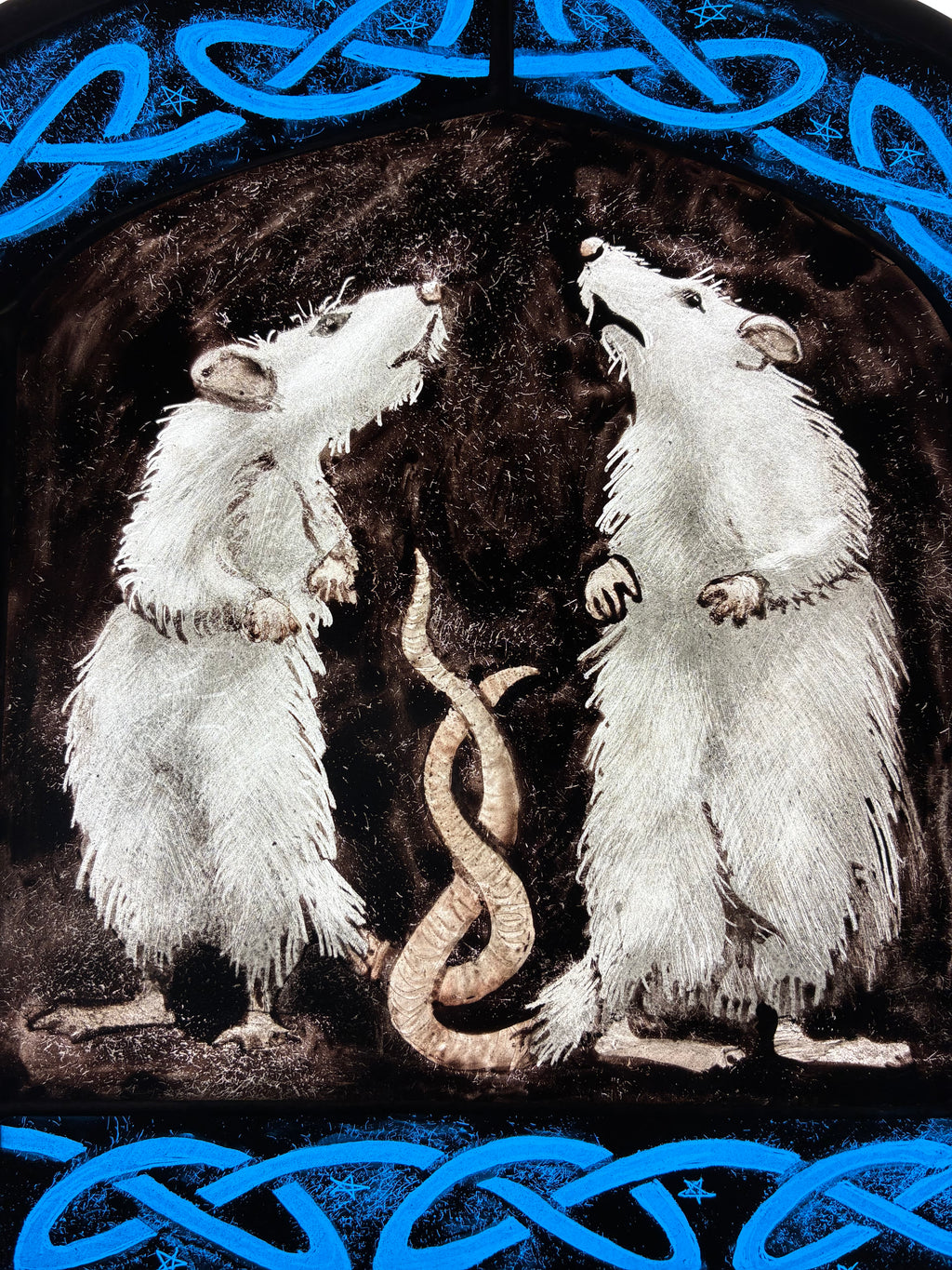 A dark fantasy artwork depicting two white rats facing each other with  their tails coiled together, framed by bright blue Celtic knot borders at the top and bottom.