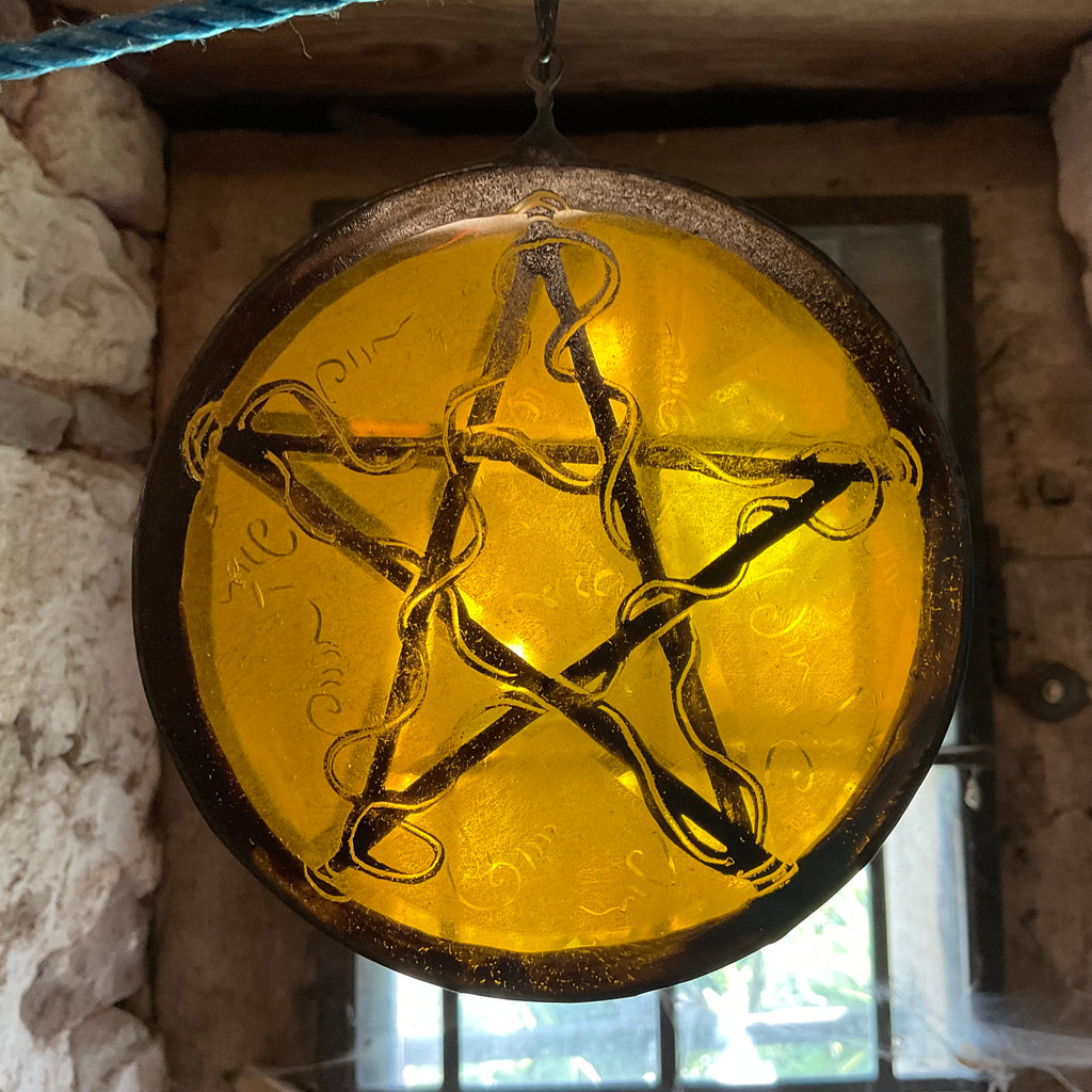 Pentacle stained glass window decoration in amber