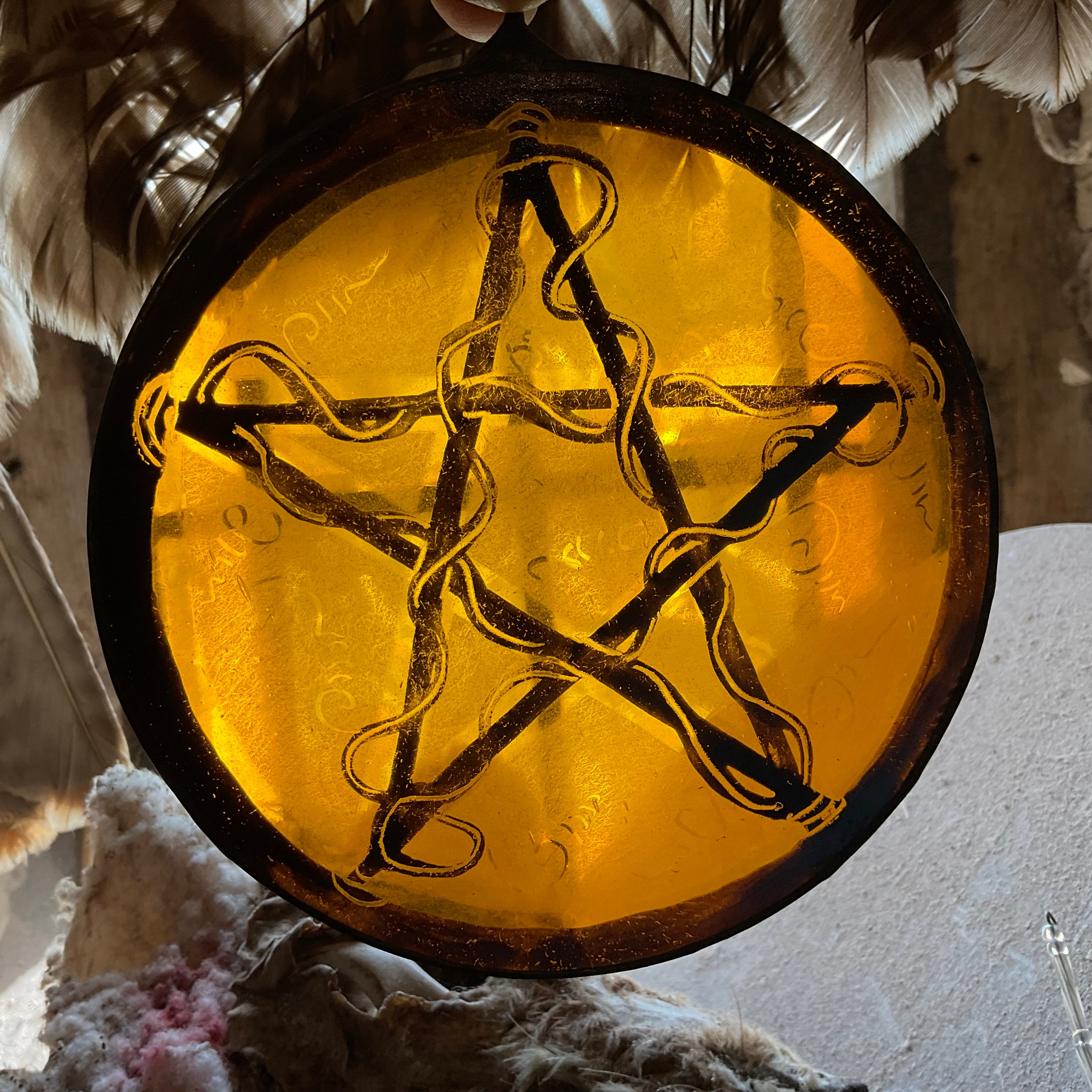 Pentacle stained glass window decoration in amber