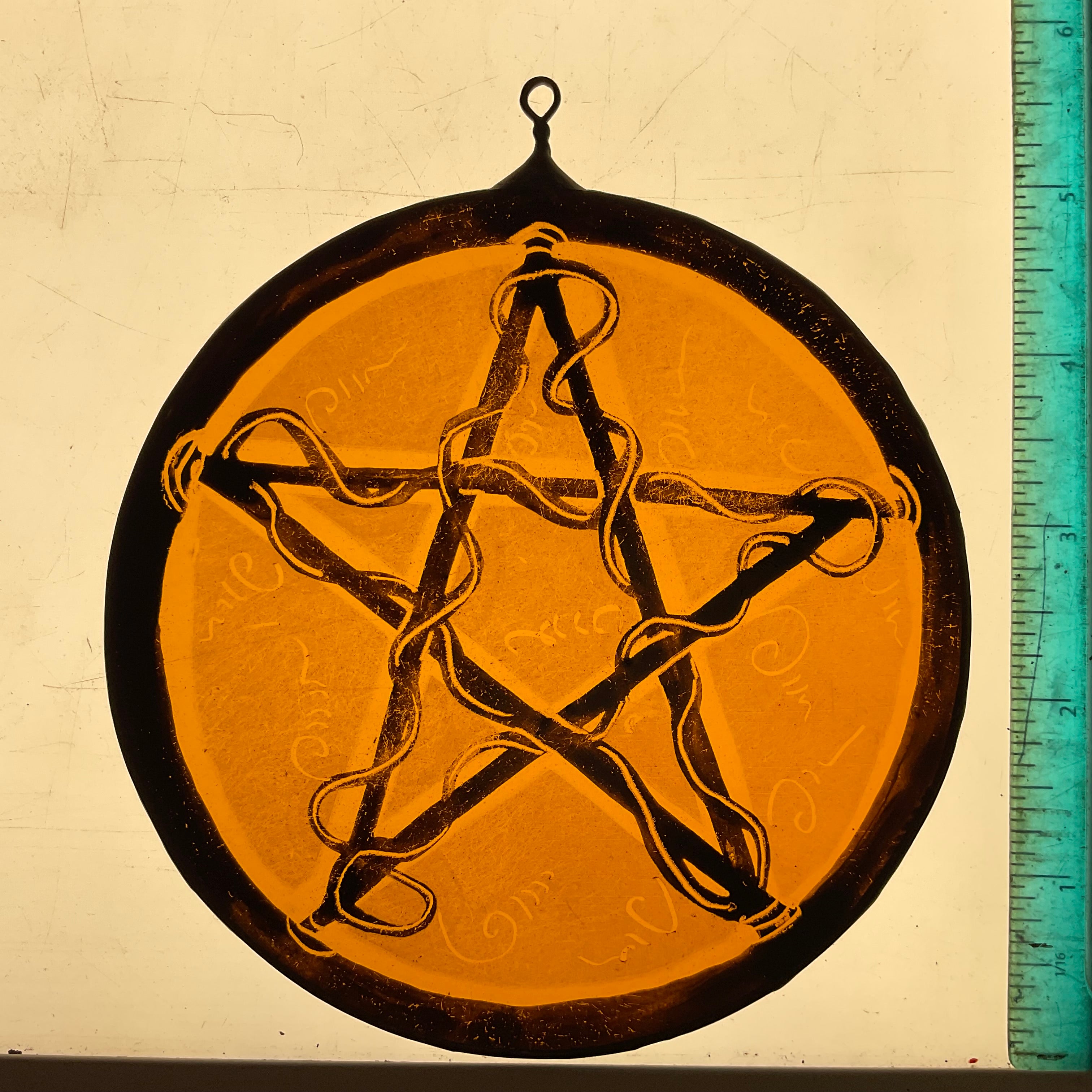 Pentacle stained glass window decoration in amber