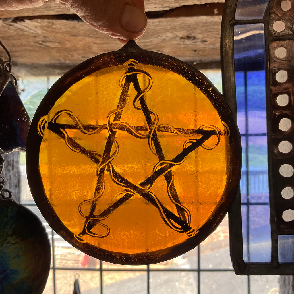 Pentacle stained glass window decoration in amber
