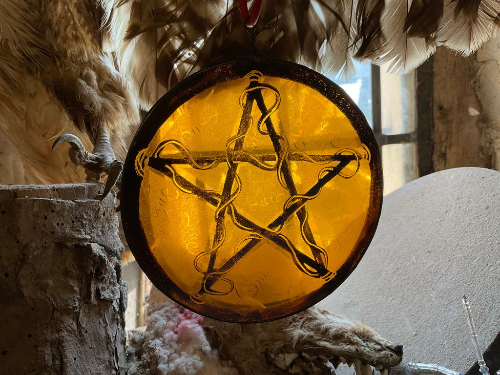 Pentacle stained glass window decoration in amber