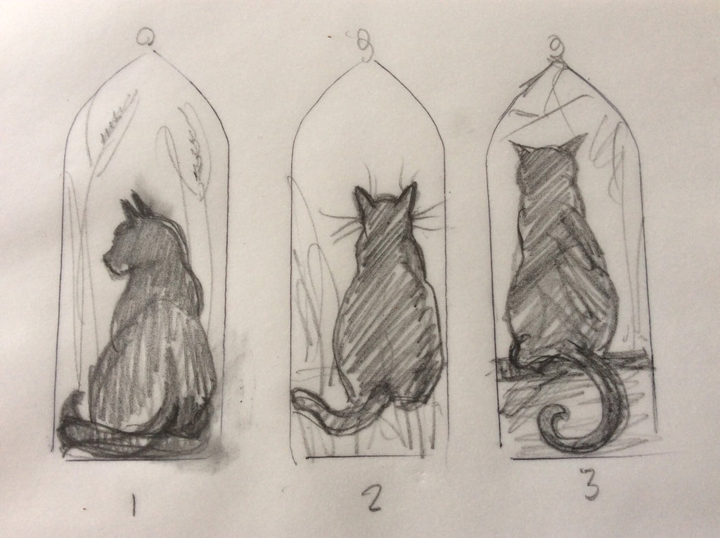 The original cat sketches for the Halloween black cat in amber stained glass
