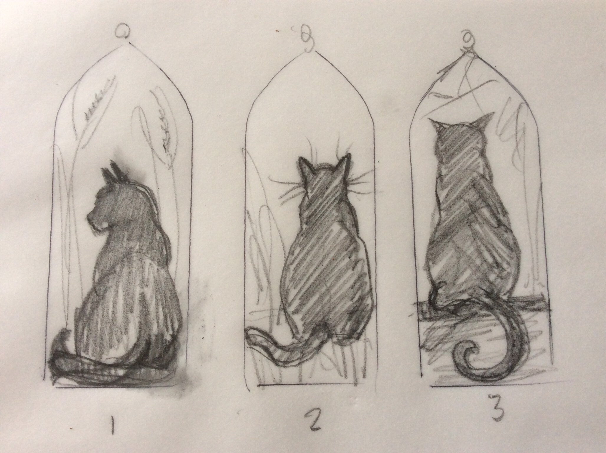 The original cat sketches for the Halloween black cat in amber stained glass