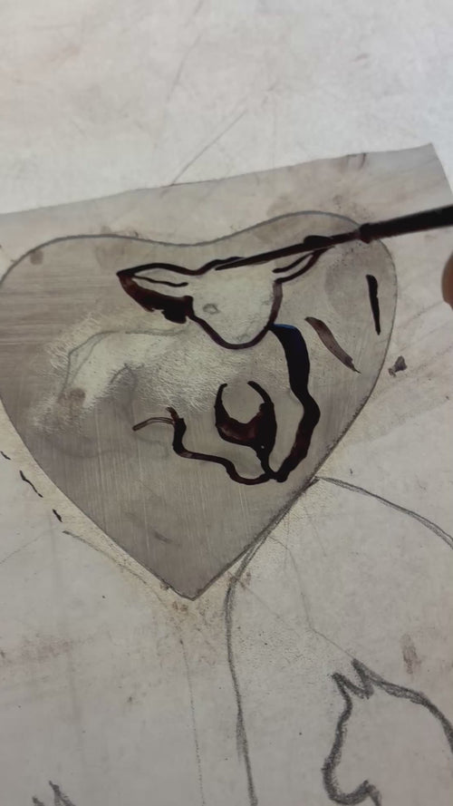 Brush working the eyes and nose and mouth of the lamb stained glass decor using enamel glass paint on the light box.  A work in progress video.